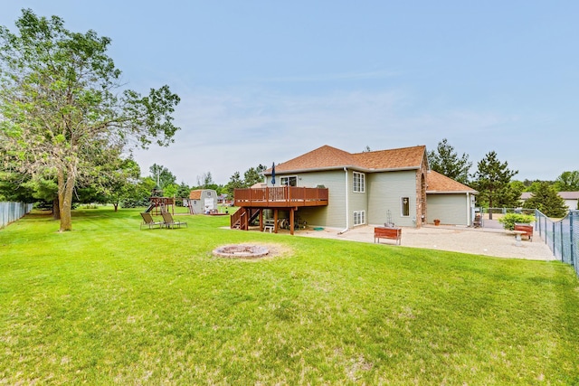 28610 Bay Shore Dr NW, Isanti, MN 55040 - view of yard with a playground, a patio, a deck, and an outdoor fire pit