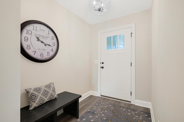 17769 Hoover St NW, Elk River, MN 55330 - entrance foyer with baseboards, dark wood finished floors, and a chandelier