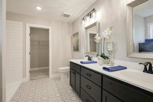 17769 Hoover St NW, Elk River, MN 55330 - bathroom with double vanity, toilet, and a spacious closet