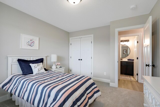 17769 Hoover St NW, Elk River, MN 55330 - bedroom featuring baseboards, light colored carpet, and a closet