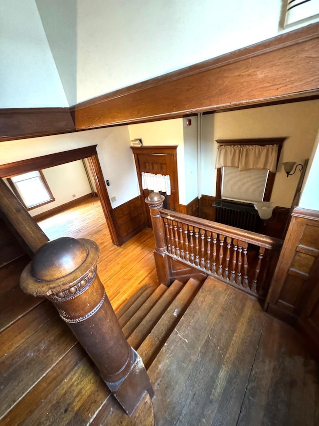 1609 11th Ave S, Minneapolis, MN 55404 - staircase featuring wood-type flooring and a wainscoted wall