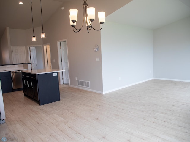 6325 83rd Ave S, Horace, ND 58047 - kitchen featuring a kitchen island, baseboards, high vaulted ceiling, light countertops, and light wood-style flooring