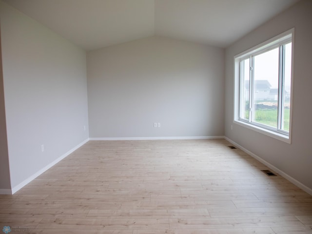 6325 83rd Ave S, Horace, ND 58047 - unfurnished room featuring light wood-type flooring, lofted ceiling, and baseboards
