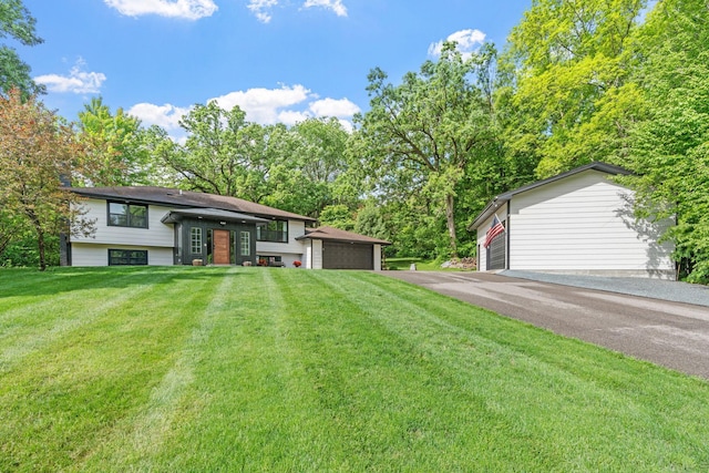 8150 Wildwood Rd, Laketown Twp, MN 55387 - split foyer home with a front yard and a garage