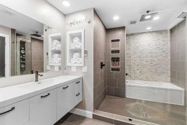 8150 Wildwood Rd, Laketown Twp, MN 55387 - bathroom featuring a garden tub, vanity, a tile shower, tile patterned floors, and recessed lighting
