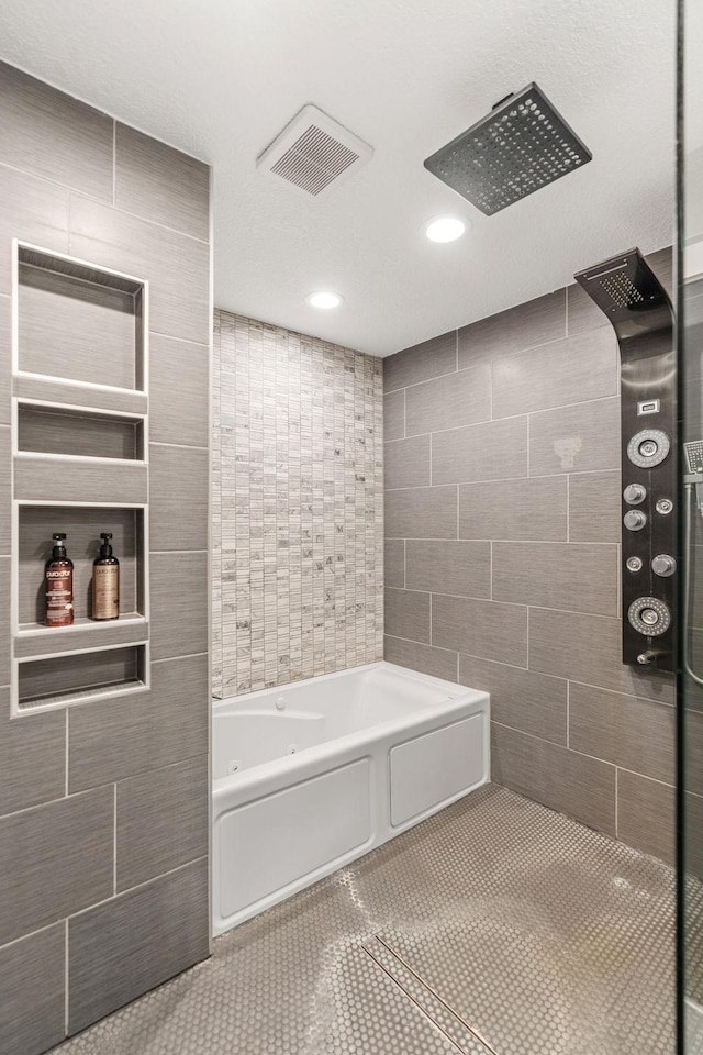 8150 Wildwood Rd, Laketown Twp, MN 55387 - full bath featuring tile walls, a jetted tub, tile patterned floors, recessed lighting, and a tile shower