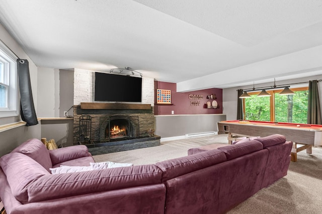 8150 Wildwood Rd, Laketown Twp, MN 55387 - carpeted living area featuring a baseboard heating unit, pool table, a fireplace, and baseboards