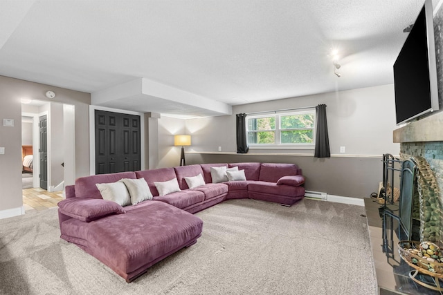 8150 Wildwood Rd, Laketown Twp, MN 55387 - living room with carpet, a fireplace, baseboards, a textured ceiling, and a baseboard heating unit