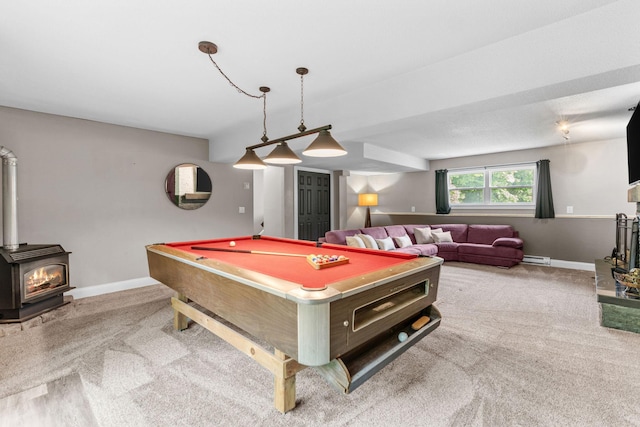 8150 Wildwood Rd, Laketown Twp, MN 55387 - rec room featuring carpet floors, a wood stove, baseboards, and billiards