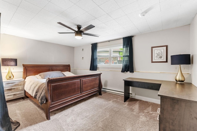 8150 Wildwood Rd, Laketown Twp, MN 55387 - carpeted bedroom with a baseboard heating unit and a ceiling fan