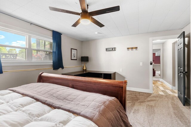 8150 Wildwood Rd, Laketown Twp, MN 55387 - bedroom with light carpet, a ceiling fan, and baseboards