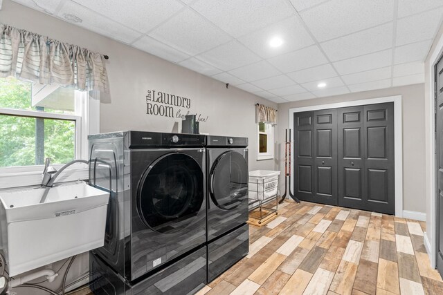 8150 Wildwood Rd, Laketown Twp, MN 55387 - washroom featuring washer and dryer and light wood finished floors