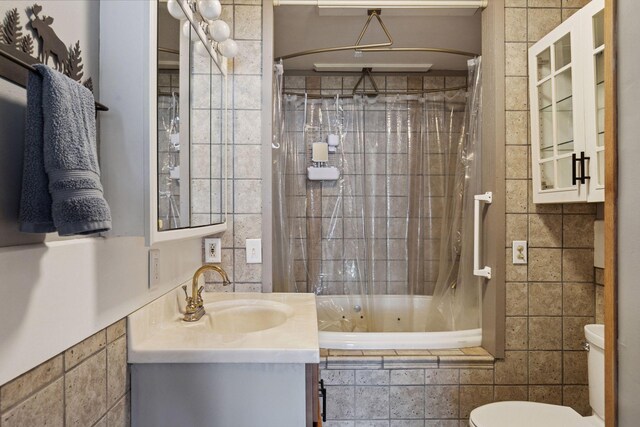 218 9 1/4 Ave, Turtle Lake, WI 54004 - full bathroom with a combined bath / shower with jetted tub, vanity, toilet, and tile walls