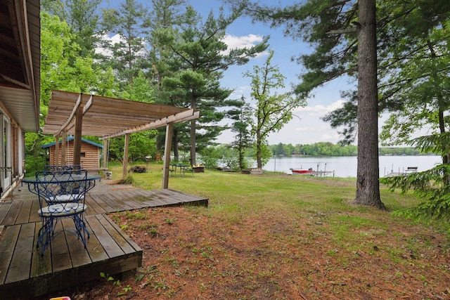 218 9 1/4 Ave, Turtle Lake, WI 54004 - view of green lawn with a deck with water view