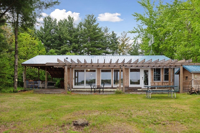 218 9 1/4 Ave, Turtle Lake, WI 54004 - rear view of property with a lawn, metal roof, and a patio area