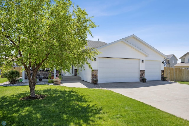1095 Parkway Ln, West Fargo, ND 58078 - view of front facade with an attached garage, driveway, and stone siding