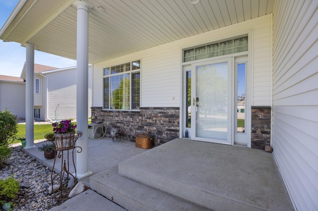 1095 Parkway Ln, West Fargo, ND 58078 - property entrance with covered porch and stone siding