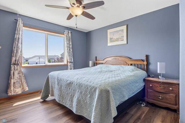 1095 Parkway Ln, West Fargo, ND 58078 - bedroom with dark wood-style flooring and a ceiling fan