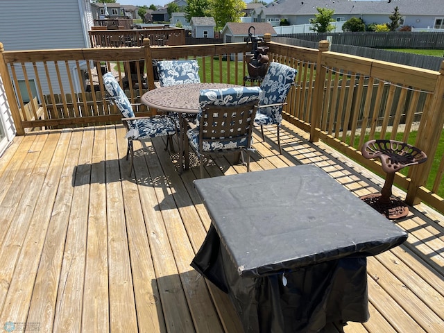 1095 Parkway Ln, West Fargo, ND 58078 - wooden terrace with outdoor dining area and a residential view