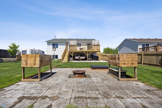 1095 Parkway Ln, West Fargo, ND 58078 - view of patio / terrace with stairway, a fire pit, and a wooden deck