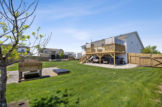 1095 Parkway Ln, West Fargo, ND 58078 - view of yard featuring stairway, a wooden deck, a patio, and a covered hot tub