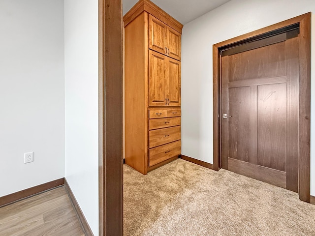 715 Lake Shore Dr NE Unit 214, Bemidji, MN 56601 - bedroom featuring baseboards and light carpet