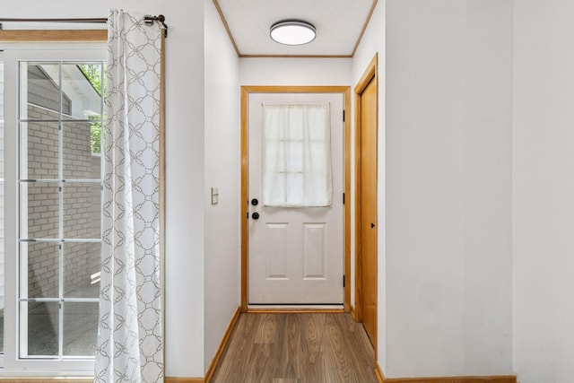 8379 Corcoran Cir Unit 47, Inver Grove Heights, MN 55076 - entryway featuring wood finished floors, baseboards, and ornamental molding