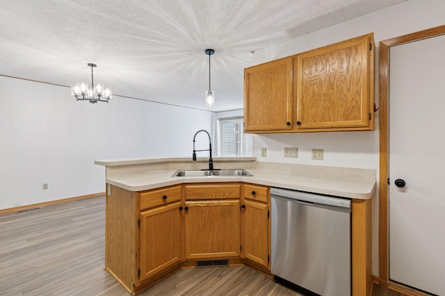 8379 Corcoran Cir Unit 47, Inver Grove Heights, MN 55076 - kitchen with dishwasher, a sink, a peninsula, light wood-type flooring, and light countertops
