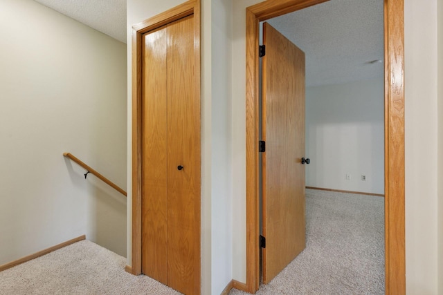 8379 Corcoran Cir Unit 47, Inver Grove Heights, MN 55076 - corridor with carpet flooring, an upstairs landing, baseboards, and a textured ceiling
