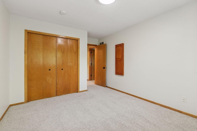 8379 Corcoran Cir Unit 47, Inver Grove Heights, MN 55076 - unfurnished bedroom with a closet, carpet, and baseboards