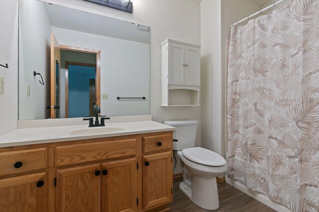 8379 Corcoran Cir Unit 47, Inver Grove Heights, MN 55076 - bathroom featuring vanity, toilet, wood finished floors, and curtained shower