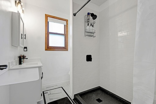 10777 70th St, Clear Lake, MN 55319 - bathroom with marble look tiles, vanity, baseboards, tiled shower, and toilet