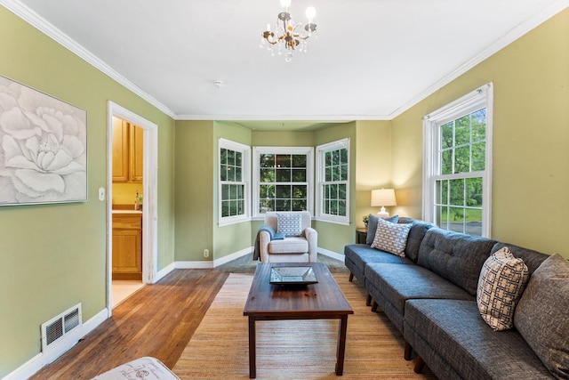 1010 Summit Ave S, Saint Paul, MN 55075 - living area with wood finished floors, a chandelier, baseboards, and ornamental molding