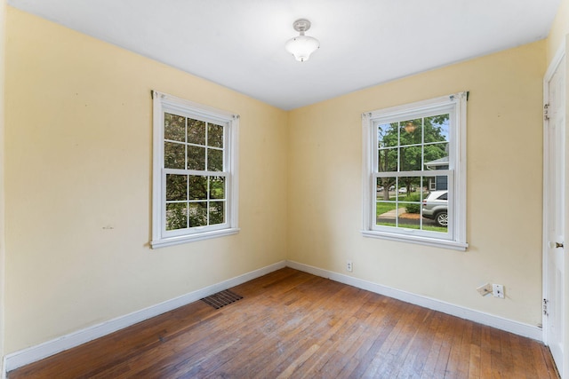 1010 Summit Ave S, Saint Paul, MN 55075 - empty room with baseboards and hardwood / wood-style flooring