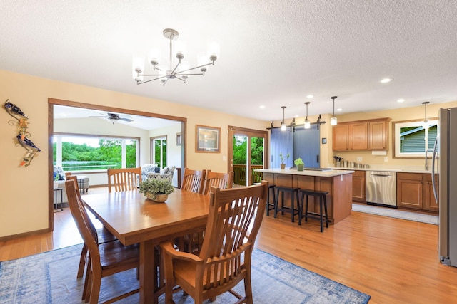 10432 102nd Pl, Maple Grove, MN 55369 - dining room with light wood-style floors, plenty of natural light, a chandelier, recessed lighting, and a textured ceiling