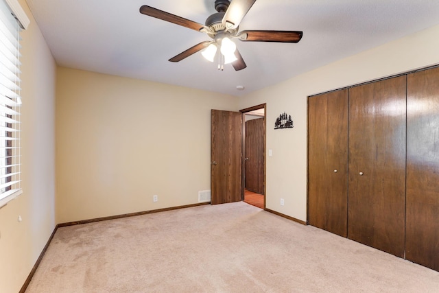 10432 102nd Pl, Maple Grove, MN 55369 - unfurnished bedroom with light carpet, a closet, ceiling fan, and baseboards