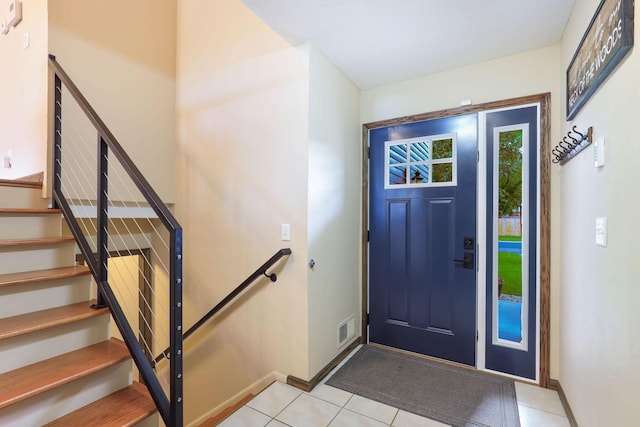 10432 102nd Pl, Maple Grove, MN 55369 - entrance foyer featuring stairs, light tile patterned floors, and baseboards