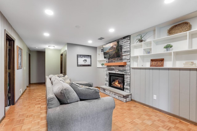 10432 102nd Pl, Maple Grove, MN 55369 - living area with built in shelves, a fireplace, recessed lighting, and baseboards