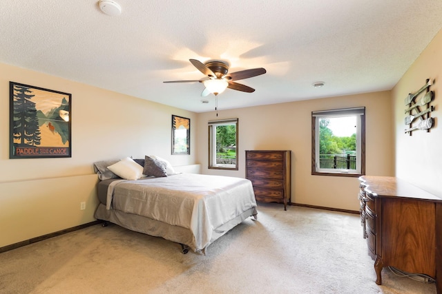 10432 102nd Pl, Maple Grove, MN 55369 - bedroom featuring light carpet, baseboards, and a ceiling fan