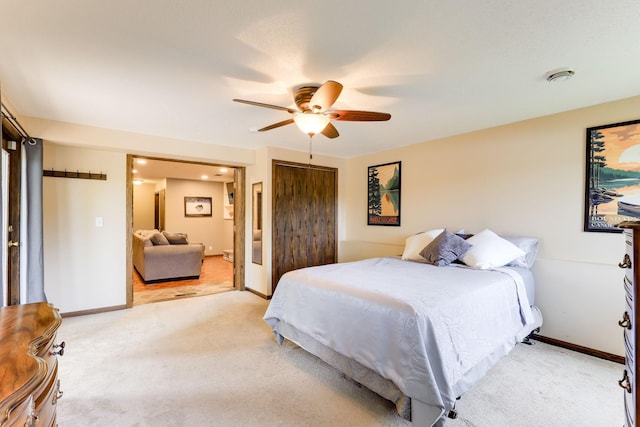 10432 102nd Pl, Maple Grove, MN 55369 - bedroom with light colored carpet, a closet, baseboards, and ceiling fan