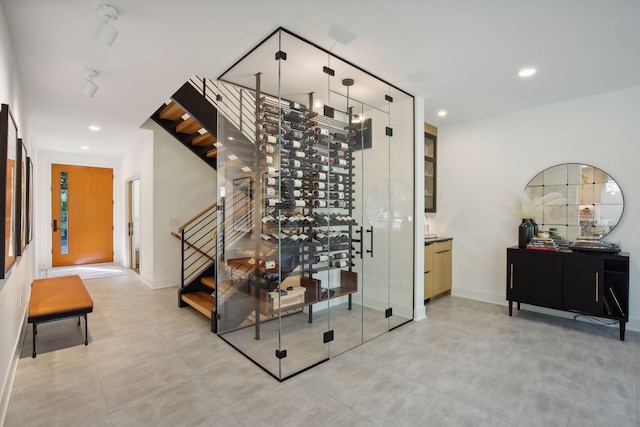 wine area featuring recessed lighting and baseboards