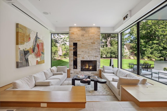 living area featuring tile patterned flooring, a fireplace, and recessed lighting