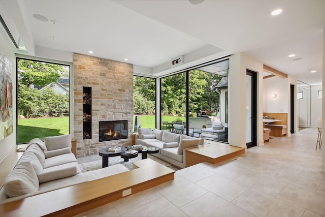 living room with light tile patterned floors, a fireplace, and recessed lighting