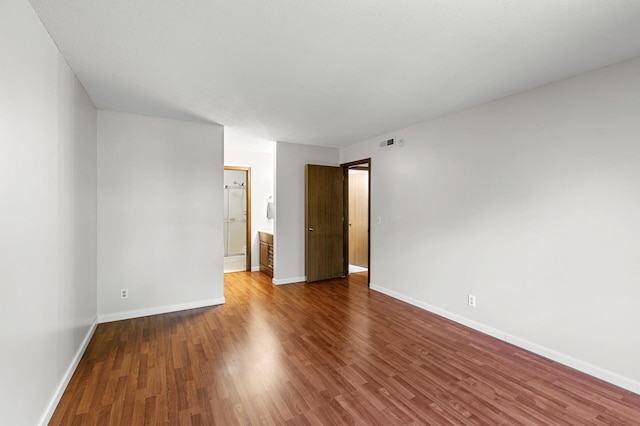 10441 Greenbrier Rd Unit 315, Minnetonka, MN 55305 - unfurnished room featuring wood finished floors and baseboards