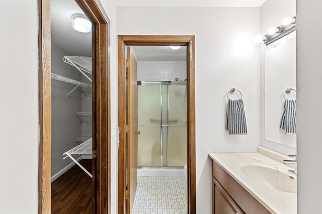 10441 Greenbrier Rd Unit 315, Minnetonka, MN 55305 - full bath featuring a stall shower, vanity, and a spacious closet
