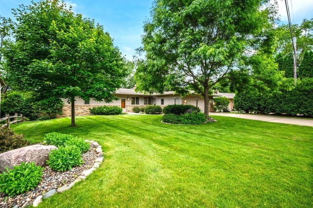 451 Reflection Rd, Apple Valley, MN 55124 - view of front of property with a front lawn, concrete driveway, and stone siding