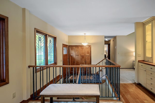 451 Reflection Rd, Apple Valley, MN 55124 - hallway featuring an upstairs landing and wood finished floors