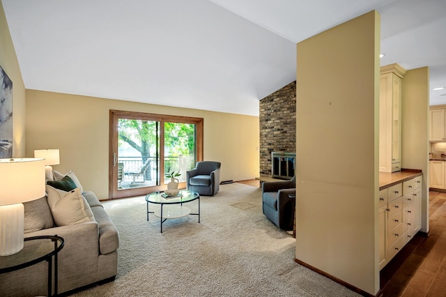 451 Reflection Rd, Apple Valley, MN 55124 - living area with a brick fireplace, vaulted ceiling, and carpet
