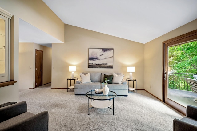 451 Reflection Rd, Apple Valley, MN 55124 - carpeted living room featuring lofted ceiling and baseboards