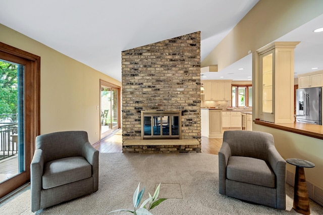 451 Reflection Rd, Apple Valley, MN 55124 - living area featuring healthy amount of natural light, a fireplace, lofted ceiling, light wood-type flooring, and recessed lighting
